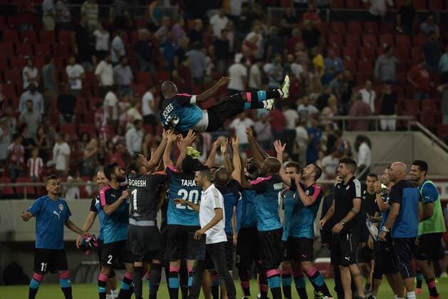 Greece: Olympiacos vs Hapoel Beer-Sheva (0-0) Football players of Hapoel Beer-Sheva celebrate the draw with the team of Olympiacos in Athens, in stadium Karaiskaki.  DimitriosxKarvountzis PacificxPress