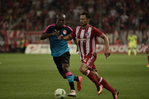 Greece: Olympiacos vs Hapoel Beer-Sheva (0-0) Alberto De La Bella (no 24) of Olympiacos tries to pass from Anthony Nwakame (no 9) of Hapoel Beer-Sheva.  DimitriosxKarvountzis PacificxPress