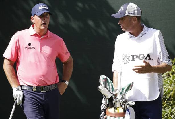 Phil Mickelson and caddie Jim Bones Mackay stand on the 16th tee box in the first round at the PGA Golf Herren Championship at Baltusrol Golf Club in Springfield, New Jersey on July 28, 2016.  PGA2016072819 JOHNxANGELILLO