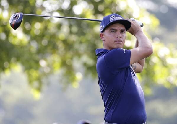 Rickie Fowler hits his tee shot on the 15th hole in the first round at the PGA Golf Herren Championship at Baltusrol Golf Club in Springfield, New Jersey on July 28, 2016.  PGA20160728124 JOHNxANGELILLO