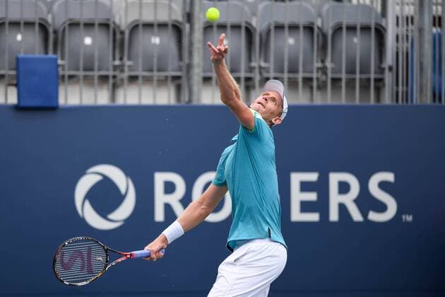 July 28, 2016: Kevin Anderson of South Africa serves the ball to Bernard Tomic of Australia during their third round match of the Rogers Cup tournament at the Aviva Centre in Toronto, Ontario, Canada on July 28, 2016. Cal Media TENNIS 2016 - Rogers Cup Toronto July 28 - ZUMAc04_