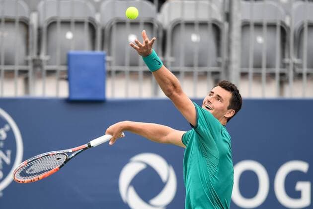 July 28, 2016: Bernard Tomic of Australia serves the ball to Kevin Anderson of South Africa during their third round match of the Rogers Cup tournament at the Aviva Centre in Toronto, Ontario, Canada on July 28, 2016. Cal Media TENNIS 2016 - Rogers Cup Toronto July 28 - ZUMAc04_
