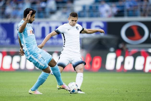 Gent s Kenneth Saief and Viitorul s Razvan Marin fights for the ball during the first leg match of the third qualifying round between Belgian first league soccer team KAA Gent and Romania s FC Viitorul Constanta in the Europa League competition, on Thursday 28 July 2016, in Gent. JASPERxJACOBS  x04899783x