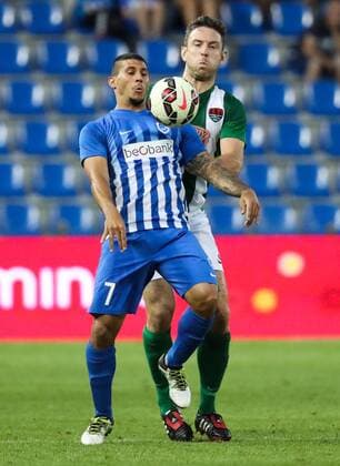Cork s Alan Bennett and Genk s Nikolaos Karelis fight for the ball during the first leg game of the third qualifying round between Belgian first league soccer team KRC Genk and Ireland s Cork City F.C. in the Europa League competition, on Thursday 28 July 2016, in Genk. VIRGINIExLEFOUR  x04899890x