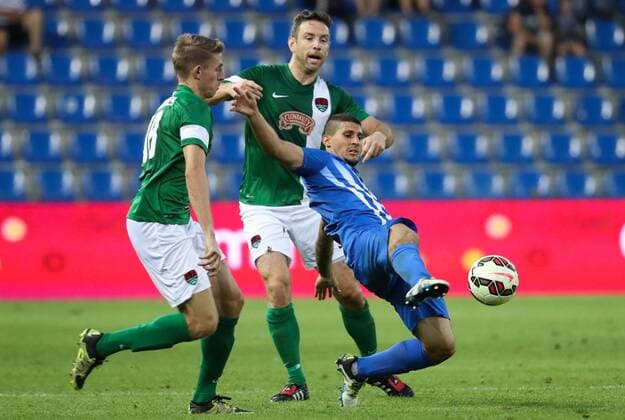 Cork s Alan Bennett and Genk s Nikolaos Karelis fight for the ball during the first leg game of the third qualifying round between Belgian first league soccer team KRC Genk and Ireland s Cork City F.C. in the Europa League competition, on Thursday 28 July 2016, in Genk. VIRGINIExLEFOUR  x04899889x