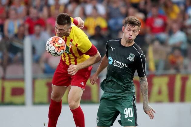 28 07 2016 Hibernians Stadium, Paola, Malta UEFA Europa League Third Qualifying Round, First Leg Birkirkara FC (Malta) v FC Krasnodar (Russia) Solomon Fedor of FC Krasnodar (in green) and Christian Bubalovic of Birkirkara FC (in yellow and red kit) during the UEFA Europa League, third qualifying round, first leg match between Birkirkar and Krasnodar of Russia. Birkirkara FC v Krasnodar - UEFA Europa League 2016 17 BKR_KRA_UEL_16_17