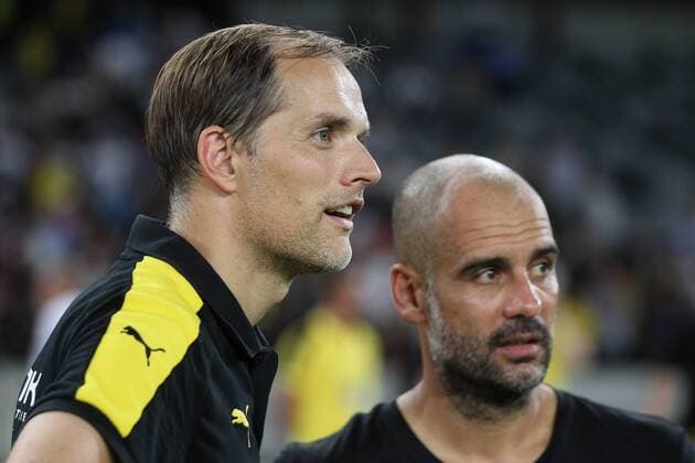 Head coach Pep Guardiola of Manchester City, right, talks to head coach Thomas Tuchel of Borussia Dortmund before the penalty shootout of the Shenzhen match of the 2016 International Champions Cup China in Shenzhen city, south China s Guangdong province, 28 July 2016. Pep Guardiola got his first taste of victory as Manchester City s manager Thursday (28 July 2016) night after beating Borussia Dortmund on penalties in a friendly, but expressed concern about the looming English Premier League season. Football today is tough, said Guardiola, whose side beat their German opposition in the southern Chinese city of Shenzhen. City won, and finally got the workout Guardiola had craved, thanks to a 6-5 penalty shootout win over Dortmund, after the game ended one apiece. City keeper Angus Gunn was the hero of penalties with three saves, including the one sealing their victory when he palmed away Mikel Merino s attempt. Manchester City beat Dortmund on penalties in Shenzhen  20160728_65261