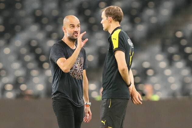 Head coach Pep Guardiola of Manchester City, left, talks to head coach Thomas Tuchel of Borussia Dortmund before the penalty shootout of the Shenzhen match of the 2016 International Champions Cup China in Shenzhen city, south China s Guangdong province, 28 July 2016. Pep Guardiola got his first taste of victory as Manchester City s manager Thursday (28 July 2016) night after beating Borussia Dortmund on penalties in a friendly, but expressed concern about the looming English Premier League season. Football today is tough, said Guardiola, whose side beat their German opposition in the southern Chinese city of Shenzhen. City won, and finally got the workout Guardiola had craved, thanks to a 6-5 penalty shootout win over Dortmund, after the game ended one apiece. City keeper Angus Gunn was the hero of penalties with three saves, including the one sealing their victory when he palmed away Mikel Merino s attempt. Manchester City beat Dortmund on penalties in Shenzhen  20160728_12389