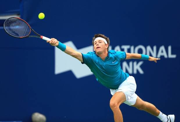 (160729) -- TORONTO, July 29, 2016 -- Jared Donaldson of the United States returns the ball against Milos Raonic of Canada during their third round of men s singles match at the 2016 Rogers Cup in Toronto, Canada, July 28, 2016. Jared Donaldson lost 0-2. )(hcs) (SP)CANADA-TORONTO-TENNIS-ROGERS CUP-MEN S SINGLES ZouxZheng 