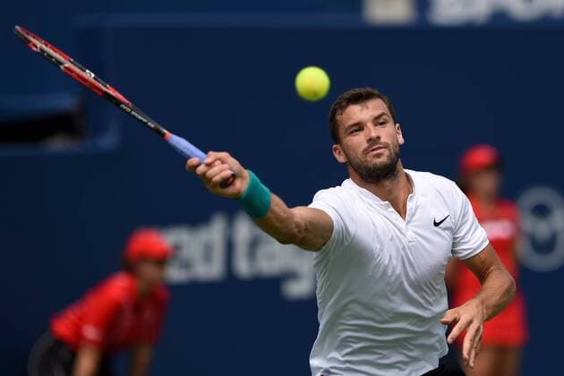 July 29, 2016: Grigor Dimitrov of Bulgaria returns the ball to Kei Nishikori of Japan during their quarter finals match of the Rogers Cup tournament at the Aviva Centre in Toronto, Ontario, Canada on July 29, 2016. Cal Media TENNIS 2016 - Rogers Cup Toronto July 29 - ZUMAc04_