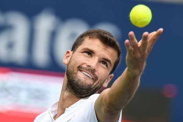 July 29, 2016: Grigor Dimitrov of Bulgaria serves the ball to Kei Nishikori of Japan before their quarter finals match of the Rogers Cup tournament at the Aviva Centre in Toronto, Ontario, Canada on July 29, 2016. Cal Media TENNIS 2016 - Rogers Cup Toronto July 29 - ZUMAc04_