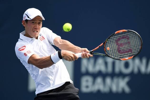 July 29, 2016: Kei Nishikori of Japan returns the ball to Grigor Dimitrov of Bulgaria during their quarter finals match of the Rogers Cup tournament at the Aviva Centre in Toronto, Ontario, Canada on July 29, 2016. Cal Media TENNIS 2016 - Rogers Cup Toronto July 29 - ZUMAc04_