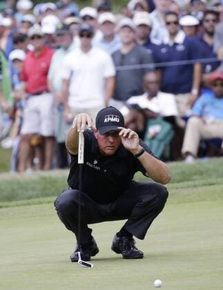 Phil Mickelson lines up a putt on the 4th hole in the second round at the PGA Golf Herren Championship at Baltusrol Golf Club in Springfield, New Jersey on July 29, 2016.  PGA20160729115 JOHNxANGELILLO