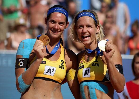 BEACHVOLLEYBALL - A1 Major Klagenfurt 2016 KLAGENFURT,AUSTRIA,30.JUL.16 - Beach volleyball Beachvolleyball - FIVB World Tour 2016, A1 Major Klagenfurt, women, award ceremony. Image shows the rejoicing of Kira Walkenhorst and Laura Ludwig (GER). GEPAxpictures xDanielxGoetzhaber