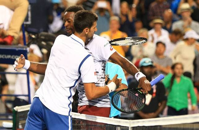 (160731) -- TORONTO, July 30, 2016 -- Novak Djokovic (front) of Serbia hugs Gael Monfils of France after the semifinal match of men s singles at the 2016 Rogers Cup in Toronto, Canada, July 30, 2016. Novak Djokovic won 2-0. ) (SP)CANADA-TORONTO-TENNIS-ROGERS CUP-MEN S SINGLES ZouxZheng 