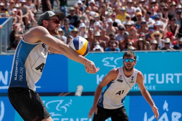 BEACHVOLLEYBALL - A1 Major Klagenfurt 2016 KLAGENFURT,AUSTRIA,31.JUL.16 - Beach volleyball Beachvolleyball - FIVB World Tour 2016, A1 Major Klagenfurt, men. Image shows Chaim Schalk and Ben Saxton (CAN). GEPAxpictures xMaticxKlansek