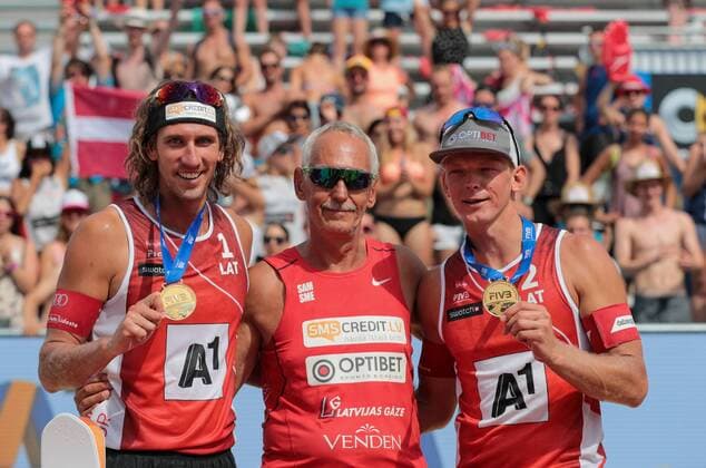 BEACHVOLLEYBALL - A1 Major Klagenfurt 2016 KLAGENFURT,AUSTRIA,31.JUL.16 - Beach volleyball Beachvolleyball - FIVB World Tour 2016, A1 Major Klagenfurt, men, award ceremony. Image shows Aleksandrs Samoilovs and Janis Smedins (LAT) with coach. GEPAxpictures xMaticxKlansek