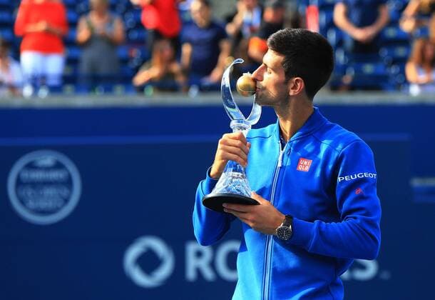 (160801) -- TORONTO, Aug. 1, 2016 -- Novak Djokovic of Serbia kisses his trophy during the awarding ceremony of the men s singles final at the 2016 Rogers Cup in Toronto, Canada, July 31, 2016. Novak Djokovic defeated Kei Nishikori of Japan 2-0 and claimed the title. ) (SP)CANADA-TORONTO-TENNIS-ROGERS CUP-MEN S SINGLES-FINAL ZouxZheng 