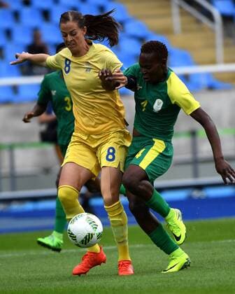 (160803) -- RIO DE JANEIRO, Aug. 3, 2016 -- Lotta Schelin (L) of Sweden competes during the opening match of the women s Olympic football competitions against South Africa at the Olympic Stadium in Rio de Janeiro, Brazil, Aug. 3, 2016. Sweden won 1-0. ) (SP)BRAZIL-RIO DE JANEIRO-OLYMPICS-WOMNE S FOOTBALL-SWEDEN VS SOUTH AFRICA YanxYan 