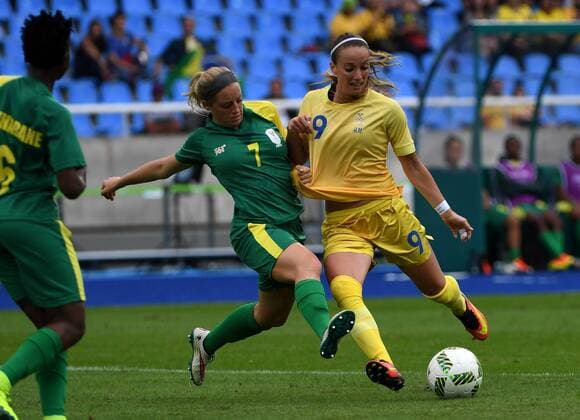 (160803) -- RIO DE JANEIRO, Aug. 3, 2016 -- Kosovare Asllani (R) of Sweden shoots the ball during the opening match of the women s Olympic football competitions against South Africa at the Olympic Stadium in Rio de Janeiro, Brazil, Aug. 3, 2016. Sweden won 1-0. ) (SP)BRAZIL-RIO DE JANEIRO-OLYMPICS-WOMNE S FOOTBALL-SWEDEN VS SOUTH AFRICA YanxYan 