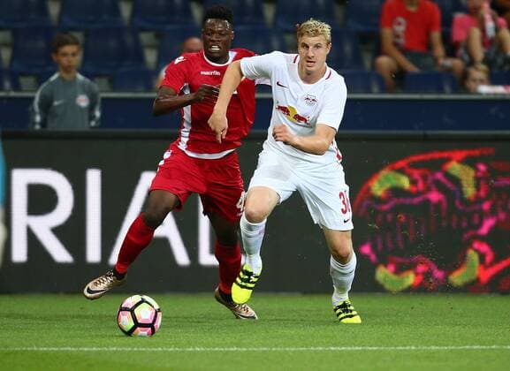 SOCCER - UEFA CL quali, RBS vs Tirana SALZBURG,AUSTRIA,03.AUG.16 - SOCCER - UEFA Champions League, qualification, Red Bull Salzburg vs FK Partizani Tirana. Image shows Caleb Ekuban (Tirana) and Martin Hinteregger (RBS). GEPAxpictures xFelixxRoittner