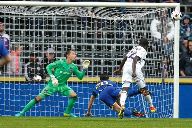 Anderlecht s goalkeeper Davy Roef, Rostov s Sardar Azmoun and Anderlecht s Dennis Appiah fight for the ball during the return leg of the third qualification round for the Champions League competition between Belgian first league soccer team RSC Anderlecht and Russian team FC Rostov in Brussels, Wednesday 03 August 2016. The first leg ended in a 2-2 draw. BRUNOxFAHY  x04902923x