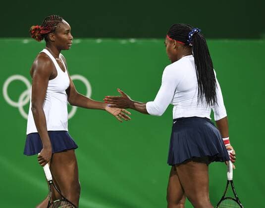 (160807) -- RIO DE JANEIRO, Aug. 7, 2016 -- Venus Williams (L) and Serena Williams react during women s first round doubles tennis match against Czech Republic s Lucie Safarova Barbora Strycova at the 2016 Rio Olympic Games Olympische Spiele Olympia OS in Rio de Janeiro, Brazil, on Aug. 7, 2016. Venus Williams and Serena Williams lost 0-2.?Xinhua ?(xr) (SP)BRAZIL-RIO DE JANEIRO-OLYMPICS-TENNIS LiuxJie 