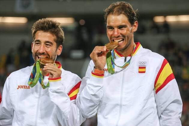 August 12, 2016 - Rio De Janeiro, Rio de Janeiro, Brazil - RJ - Olympic Tennis Games - SPORTS - Rafael Nadal and Marc Lopez of Spain celebrate winning the gold medal in the men s tennis doubles tennis tournament at the Olympic Center in the Olympic Games Olympische Spiele Olympia OS in Rio de Janeiro 2016 in Brazil, this sexta- Friday RIO 2016 - Tennis: Men™s - ZUMAb158