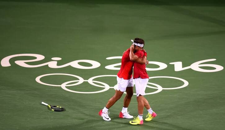 (160812) -- RIO DE JANEIRO, Aug. 12, 2016 -- Rafael Nadal (L) and Marc Lopez of Spain celebrate after the final of men s doubles tennis against Florin Mergea and Horia Tecau of Romania at the 2016 Rio Olympic Games Olympische Spiele Olympia OS in Rio de Janeiro, Brazil, on Aug. 12, 2016. Rafael Nadal and Marc Lopez won the gold medal. )(dh) (SP)BRAZIL-RIO DE JANEIRO-OLYMPICS-TENNIS YuexYuewei 