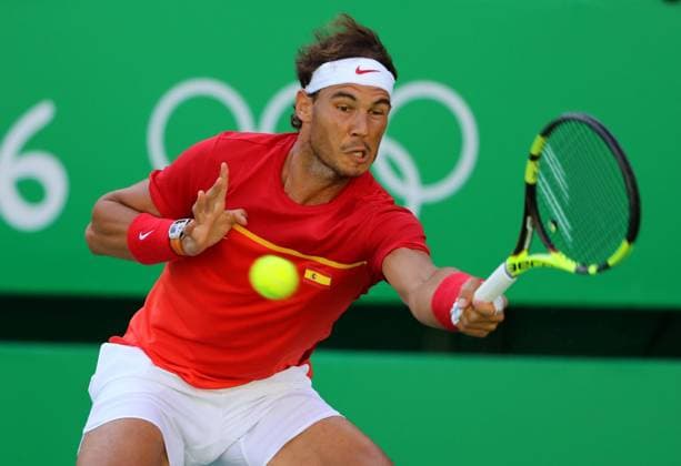 Spanish tennis player Rafa Nadal returns the ball to Argentinian Juan Martin Del Potro during their Olympic Games Olympische Spiele Olympia OS Rio 2016 Men s Singles Semifinal match at the Olympic Tennis Centre in Rio de Janeiro, Brazil, 13 August 2016. MEN S SINGLES SEMIFINAL NADAL VS. DEL POTRO !ACHTUNG: NUR REDAKTIONELLE NUTZUNG!  RIO045 20160813-636067168501515227