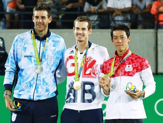 Olympics: Victory ceremony for men s tennis Gold medalist Andy Murray (C) of Britain, silver medal winner Juan Martin del Potro (L) of Argentina and bronze medalist Kei Nishikori of Japan pose for a photo at the victory ceremony for the men s tennis tournament at the Rio de Janeiro Olympics on Aug. 14, 2016. 