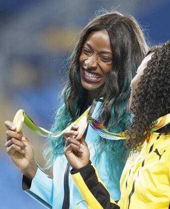 Olympics: Women s 400m medal ceremony Gold medalist Shaunae Miller (L) of the Bahamas smiles during the medal ceremony for the women s 400 meters at the Rio de Janeiro Olympics on Aug. 16, 2016. 