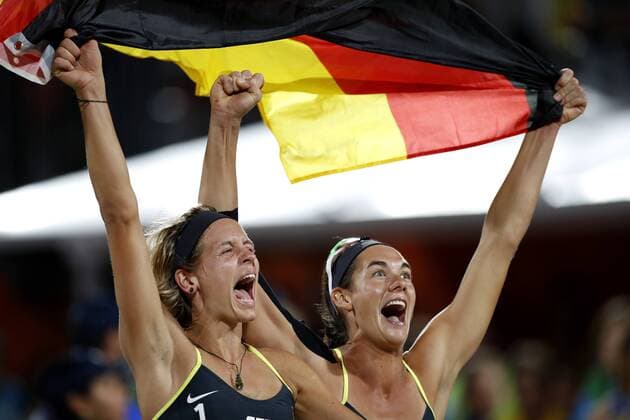 Olympics 2016 Beach volleyball Beachvolleyball RIO DE JANEIRO, RJ - 18.08.2016: OLYMPICS 2016 BEACH VOLLEYBALL - German duo celebrates victory during match valid for the gold medal between the double Laura Ludwig Kira Walkenhorst (GER) and Agatha Bednarczuk Rippel Barbara Seixas de Freitas (BRA) in the Olympic Beach Volleyball 2016 held at the Beach Volleyball Arena on Copacabana Beach. NOT AVAILABLE FOR LICENSING IN CHINA (Photo: Rodolfo Buhrer La Imagem Fotoarena) x1187688x  RodolfoxBuhrer