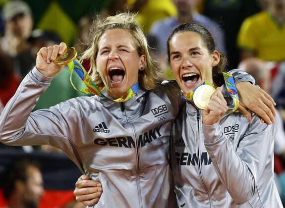 German duo win gold in women s Beach volleyball Beachvolleyball Germany s Laura Ludwig (L) and Kira Walkenhorst celebrate as they won the gold in women s beach volleyball at the Rio de Janeiro Olympics by beating Brazil 2-0 on Aug. 18, 2016. 