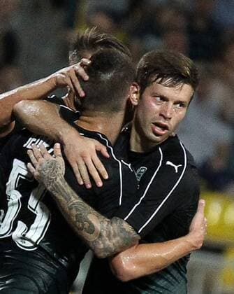 KRASNODAR, RUSSIA - AUGUST 18, 2016: Krasnodar s Fyodor Smolov (R) and Artur Jedrzejczyk celebrate their 4-0 victory over Partizani Tirana in the first leg of their UEFA Europa League play-off tie at Kuban Stadium. Krasnodar won 4-0. Vitaly Timkiv TASS soccer; Russia; Albania; football  TS02DAEA