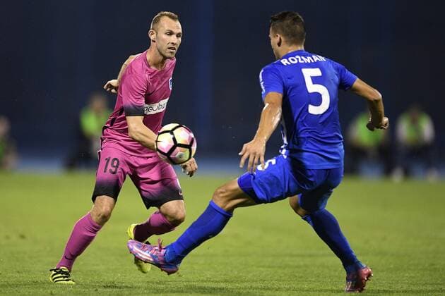 Genk s Thomas Buffel and Lokomotivo s Sinisa Rozman fight for the ball during the first leg match of the playoff round between Croatian team Lokomotiva Zagreb and Belgian first league soccer team KRC Genk in the Europa League competition, on Thursday 18 August 2016, in Zagreb, Croatia. YORICKxJANSENS  x04913820x