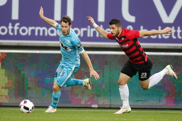 Gent s Thomas Matton and Shkendija s Besir Demiri fight for the ball during the first leg match of the playoff round between Belgian first league soccer team KAA Gent and Macedonia s first league soccer team Shkendija in the Europa League competition, on Thursday 18 August 2016, in Gent. BRUNOxFAHY  x04913841x
