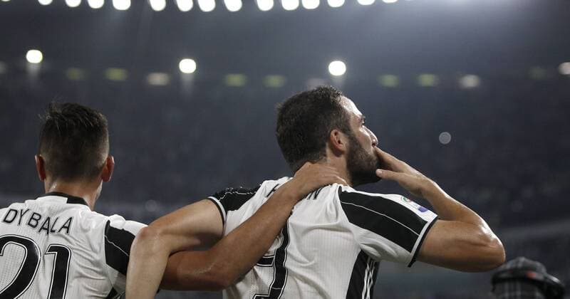Italy Soccer Serie A: Juventus beats Fiorentina 2-1 JuventusÕ Gonzalo Higuain, right, is hugged by teammate Paulo Dybala after scoring the winning goal during the Italian Serie A football match between Juventus and Fiorentina at the Juventus Stadium. Juventus won 2-1.  IsabellaxBonottoxUPDATEx xPacificxPress