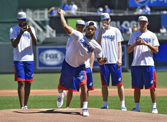 August 21, 2016 - Kansas City, MO, USA - University of Kansas basketball point guard Frank Mason is surrounded by teammates as he throws out the first pitch before Sunday s baseball game between the Kansas City Royals and Minnesota Twins on Aug. 21, 2016 at Kauffman Stadium in Kansas City, Mo. Minnesota Twins vs. Kansas City Royals - ZUMAm67_