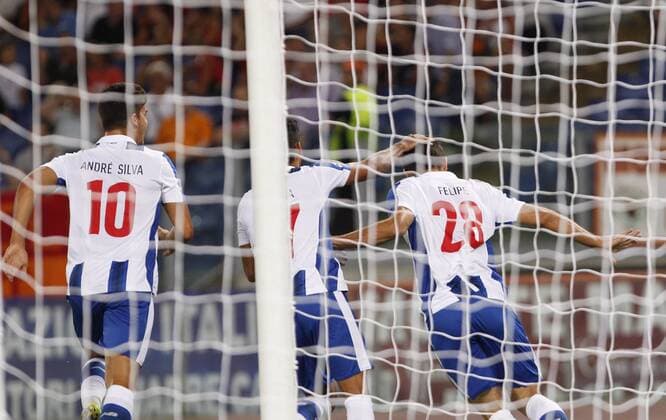 Italy: Soccer Champions League: Porto defeats Roma FC PortoÕs Felipe, right, celebrates after scoring during the Champions League play-offs second leg soccer match between Roma and FC Porto at the Olympic stadium. Porto won 3-0 to join the tournament group stage.  RiccardoxDexLucax xPacificxPress