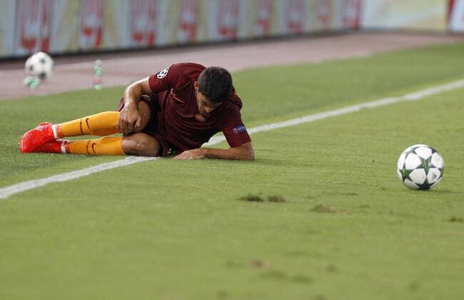 Italy: Soccer Champions League: Porto defeats Roma RomaÕs Diego Perotti lies on the pitch during the Champions League play-offs second leg soccer match between Roma and FC Porto at the Olympic stadium. Porto won 3-0 to join the tournament group stage.  RiccardoxDexLucax xPacificxPress