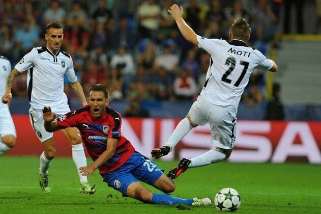 Marek Bakos of Viktoria Pilsen, second left, and Cosmin Moti of Ludogorets Razgrad, right, in action during the 4th qualifying round of football Champions League return match FC Viktoria Pilsen vs PFC Ludogorets Razgrad in Pilsen, Czech Republic, August 23, 2016. (CTKxPhoto PavelxNemecek) CTKPhotoP201608230830001  nmc7