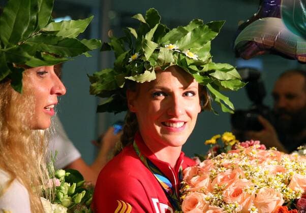 MOSCOW REGION, RUSSIA â€“ AUGUST 23, 2016: Rio 2016 Olympic synchronised swimming champions Natalia Ishchenko (L) and Svetlana Romashina wear laurel wreaths as they arrive at Sheremetyevo International Airport from Rio de Janeiro, the host city of the 2016 Summer Olympic Games Olympische Spiele Olympia OS Dmitry Serebryakov TASS  TS02E538
