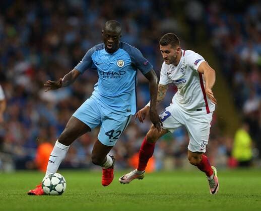 Yaya Toure of Manchester City tussles with Ovidiu Popescu of FC Steaua Bucuresti during the Champions League Play Off 2nd Leg match at the Etihad Stadium, Manchester. Picture date: August 24th, 2016. Pic Simon Bellis Sportimage EDITORIAL USE ONLY. No use with unauthorised audio, video, data, fixture lists, club league logos or live services. Online in-match use limited to 120 images, no video emulation. No use in betting, games or single club league player publications.
