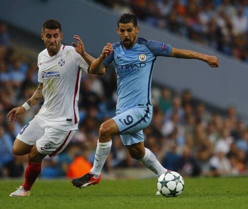 24.08.2016. Etihad Stadium, Manchester, England. Champions League Qualifying Football. Manchester City versus Steaua Bucharest. Manchester City striker Nolito turns away from Steaua Bucharest defender Ovidiu Popescu. xAlanxMartinx  ActionPlus11779710