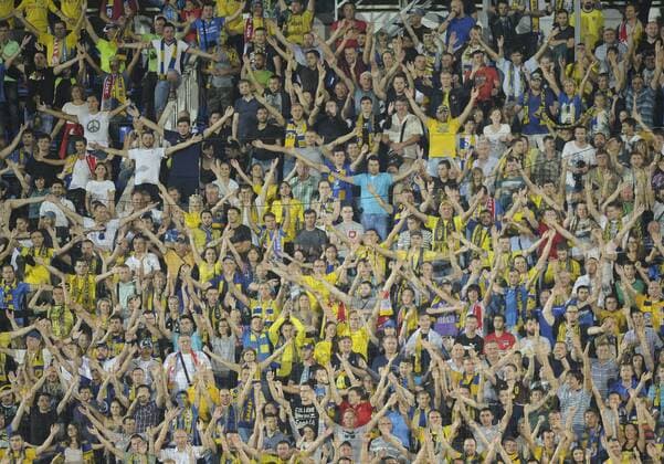 ROSTOV-ON-DON, RUSSIA - AUGUST 24, 2016: Rostov s fans rooting for their team in the 2016 17 UEFA Champions League First playoff round 2nd leg match against Ajax Amsterdam at Olimp-2 Stadium. FC Rostov won the game 4:1. Valery Matytsin TASS  TS02E7E7