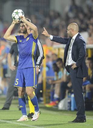 ROSTOV-ON-DON, RUSSIA - AUGUST 24, 2016: Rostov s Denis Terentyev (L) and Rostov s acting head coach Dmitry Kirichenko in the 2016 17 UEFA Champions League First playoff round 2nd leg match against Ajax Amsterdam at Olimp-2 Stadium. FC Rostov won the game 4:1. Valery Matytsin TASS  TS02E7EA