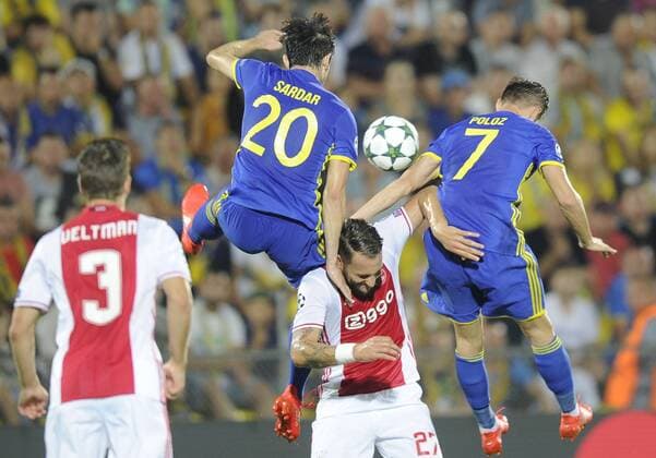 ROSTOV-ON-DON, RUSSIA - AUGUST 24, 2016: Rostov s Sardar Azmoun, Dmitry Poloz (L-R background) and Ajax s Joel Veltman, Nemanja Gudelj (L-R front) fight for the ball in their 2016 17 UEFA Champions League First playoff round 2nd leg match at Olimp-2 Stadium. FC Rostov won the game 4:1. Valery Matytsin TASS  TS02E7EE