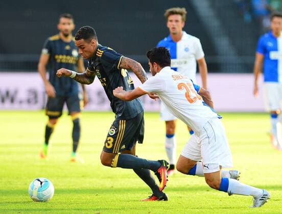 UEFA Europa league Playoff second leg match between Grasshoppers and Fenerbahce at Letzigrund Stadium in Zurich, Swiss on August 25 , 2016. Pictured: Gregory van der Wiel of Fenerbahce and Jean-Pierre Rhyner 23 of Grasshoppers. Not available for publication in Turkey. 