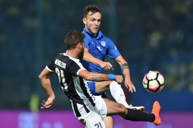 From left: Nikos Englezou of Larnaca and Daniel Bartl of Liberec in action during the fourth qualifying round return Europa League match Slovan Liberec vs AEK Larnaca in Liberec, Czech Republic, August 25, 2016. (CTKxPhoto RadekxPetrasek) CTKPhotoP201608251100201  PER 16